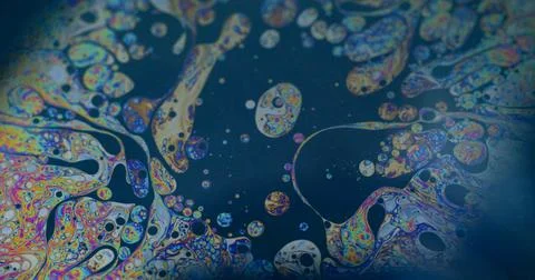 Rainbow fluid bubble spill multicolor chemical ink Stock Photos