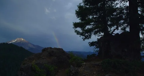 A rainbow foreshadows a break in a storm over Mt. Jefferson, OR Stock Footage 127727514