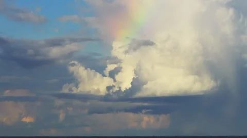 Rainbow Forming in Clouds Over Amazon Rainforest in Tambopata, Peru, Aerial Stock Footage 314319066