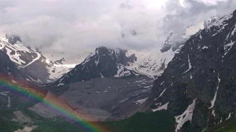 Rainbow forming over mountain valley timelapse Stock Footage 318869336
