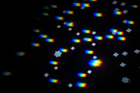 Rainbow gobo light pattern with colorful streaks and stars 스톡 사진