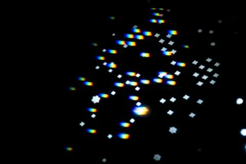 Rainbow gobo light pattern with colorful streaks and stars Foto stock