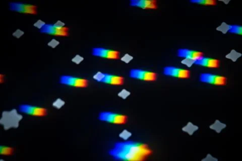Rainbow gobo light pattern with colorful streaks and stars 스톡 사진