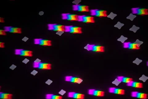 Rainbow gobo light pattern with colorful streaks and stars Stock Photos
