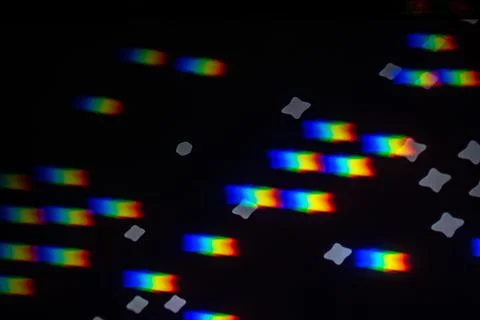 Rainbow gobo light pattern with colorful streaks and stars Foto stock