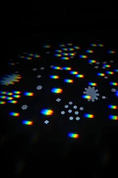 Rainbow gobo light pattern with colorful streaks and stars 写真素材