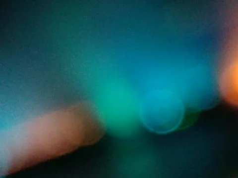 Rainbow gradient color with glowing spots of orange, black and turquoise, lik Stock Photos