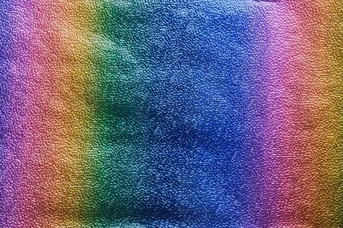 Rainbow gradient textural Background. Textured metallic paper or foil 스톡 사진