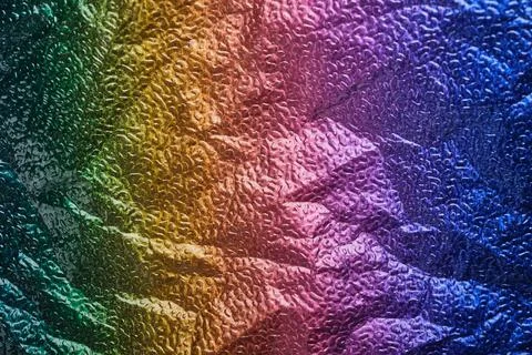 Rainbow gradient textural Background. Wrinkled folded paper or foil 写真素材