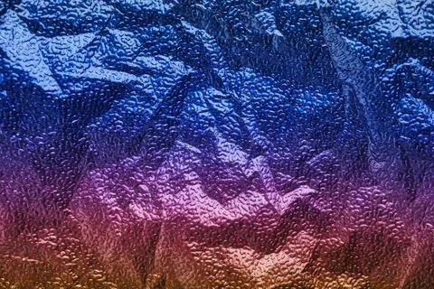 Rainbow gradient textural Background. Wrinkled folded paper or foil Fotos Stock