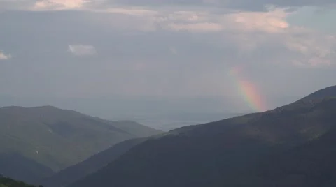 Rainbow in the Green Mountain 4K Stock Footage 64212152