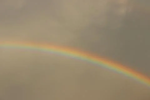 Rainbow in the grey sky Stock Photos