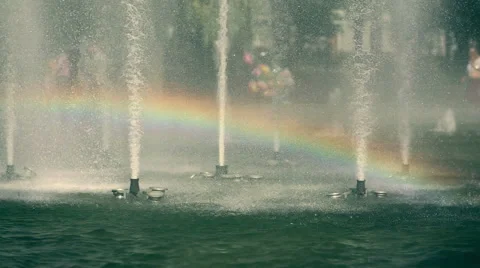 The rainbow inside the splashes of park fountane Stock Footage 47070176
