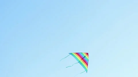 Rainbow kite flies in the sky Stock Footage 201602488