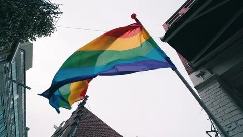 Rainbow LGBT Pride Flag blowing on wind, close up Stock Footage 127064427