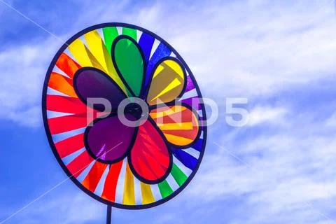 Rainbow lgbt pride spinning pinwheel. Symbol of sexual minorities, gays and l Stock Photos