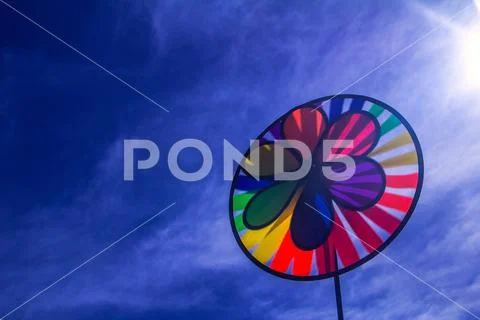 Rainbow lgbt pride spinning pinwheel. Symbol of sexual minorities, gays and Stock Photos