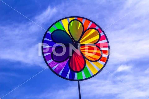 Rainbow lgbt pride spinning pinwheel. Symbol of sexual minorities, gays and Stock Photos