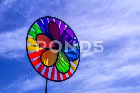 Rainbow lgbt pride spinning pinwheel. Symbol of sexual minorities, gays and Stock Photos