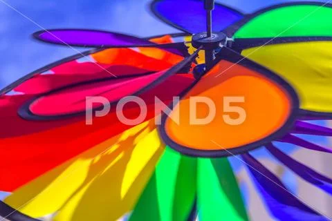 Rainbow lgbt pride spinning pinwheel. Symbol of sexual minorities, gays and l Stock Photos