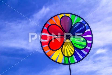 Rainbow lgbt pride spinning pinwheel. Symbol of sexual minorities, gays and l Stock Photos