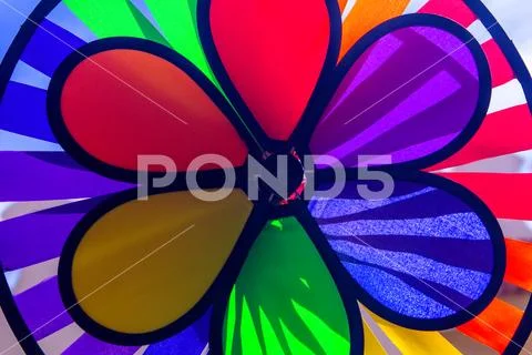 Rainbow lgbt pride spinning pinwheel. Symbol of sexual minorities, gays and l Stock Photos