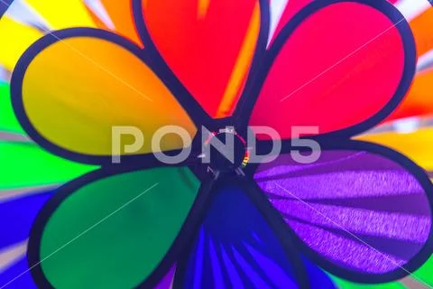 Rainbow lgbt pride spinning pinwheel. Symbol of sexual minorities, gays and l Stock Photos
