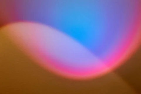 Rainbow light beam on plaster wall. multicolored abstract design background Stock Photos