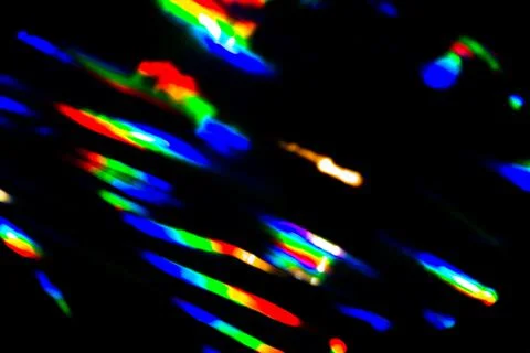 Rainbow light crystal leak selective focus overlay black background. Prism glass Illustrazione stock
