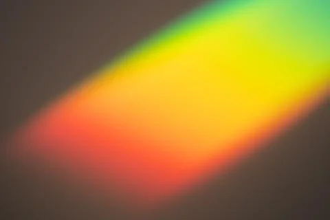 Rainbow light on dark background. Beautiful backdrop for design projects Stock Photos