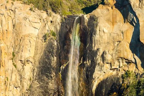 Rainbow light diffraction at the top of the Bridalveil Fall in Yosemite National Stock Photos