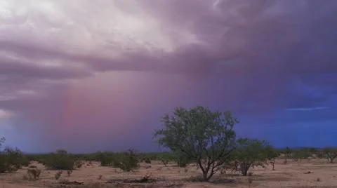 Rainbow with Lightning Strike in Desert at Sunset Stock Footage 20912153