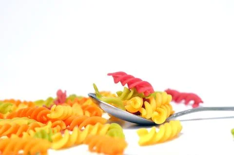 Rainbow Macaronis on white background Stock Photos