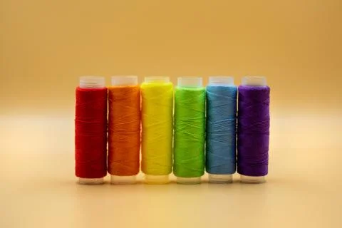 Rainbow made of colourful thread spools. LGBT community rights support concept. Stock Photos