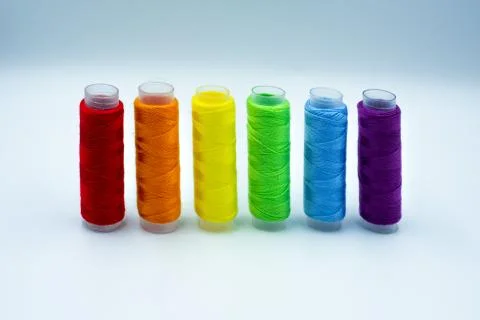 Rainbow made of colourful thread spools isolated on a white background. LGBT Stock Photos