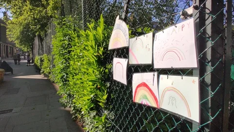 RAINBOW MESSAGES LEFT FOR KEY WORKERS DURING COVID-19 LOCKDOWN 4K Stock Footage 129095922