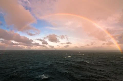 Rainbow in the middle of the sea Stock Photos