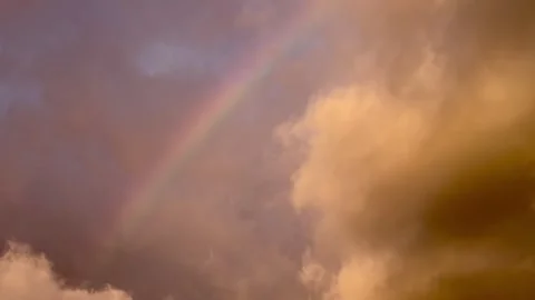 A rainbow in a moody sky with dark clouds Stock Footage 280272247