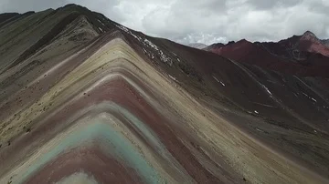 Rainbow Mountain Peru Close Aerial Drone Flyby Shot. Vinicunca Mountain of color Stock Footage