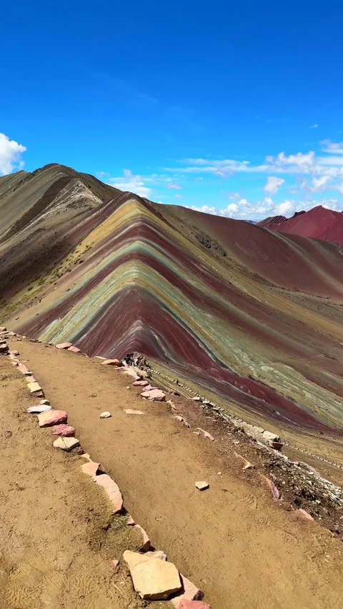 Rainbow Mountain Vinicunca vertical reel Peru Perú trail morning blue sky Stock Footage 328591416