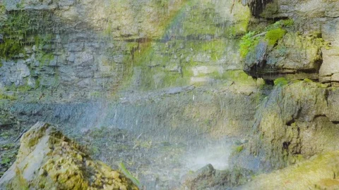 Rainbow on mountain waterfall 4k Stock Footage 82765467