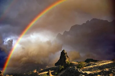 Rainbow in the mountains Stock Photos