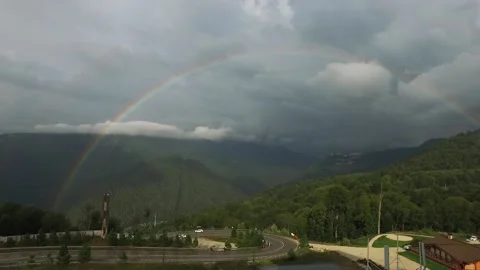 Rainbow in the mountains. A view of the sprawling rare double rainbow in the Stock Footage 149424504