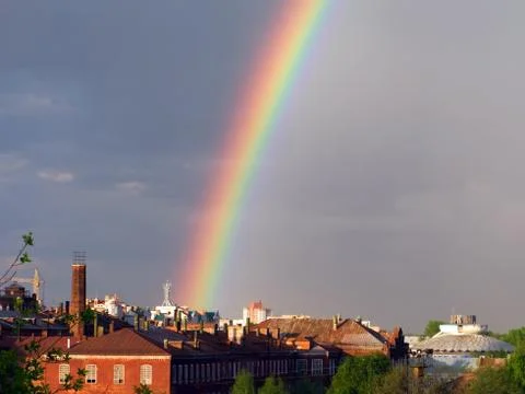 Rainbow multi color image in blue sky rain nature Foto stock