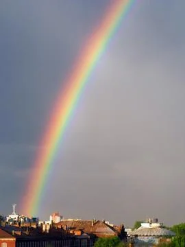 Rainbow multi color image in blue sky rain nature Stock Photos