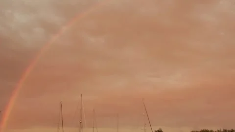 Rainbow in the orange sky on the Grevelingen Video stock 254083530