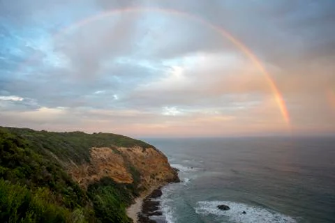 Rainbow over bay Stock Photos
