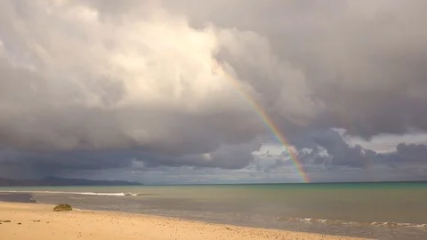 Rainbow over a beach after a thunderstorm. Fuerteventura, Spain Stock-Footage 104348683