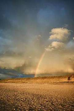 Rainbow over beach in Denmark after rain Stock Photos