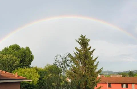 Rainbow over blue sky Stock Photos